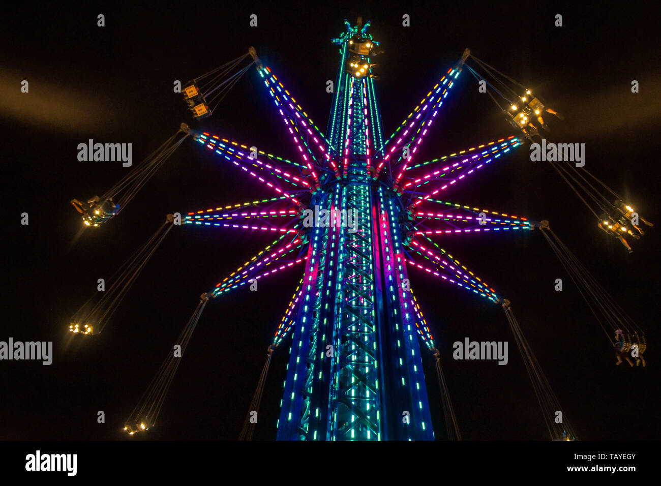 Orlando, Florida. January 19 , 2019 Child estatuel in Star Flyer attraction and partial view of Orlando Eye in International Drive area (2) Stock Photo