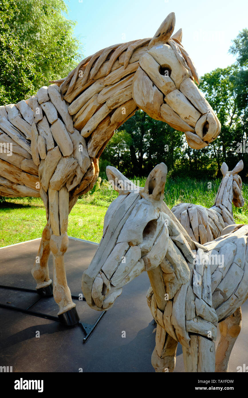 Wooden horse sculptures on display and for sale at Putgarten on Rugen island Germany. Stock Photo