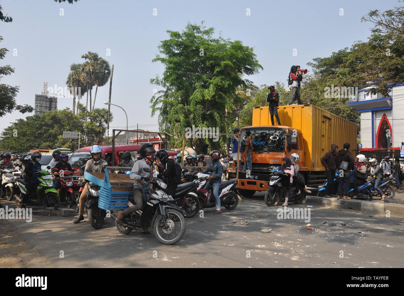 Indonesian students block Allaudin Street in front of Muhammadiah University during street rally. University students all over Indonesia hold street r Stock Photo