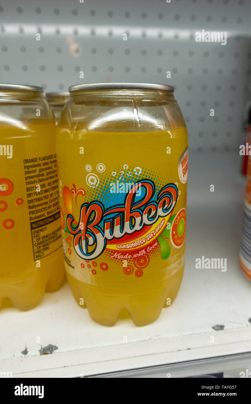 A plastic can of Bubee carbonated orange flavour soft drink in a store fridge in Co Wexford, Ireland. Stock Photo