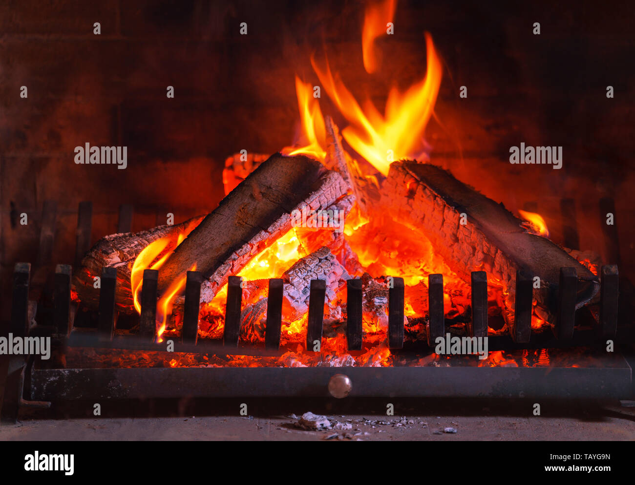 Burning fireplace. Wood burning in a cozy fireplace at home in interior Stock Photo Alamy