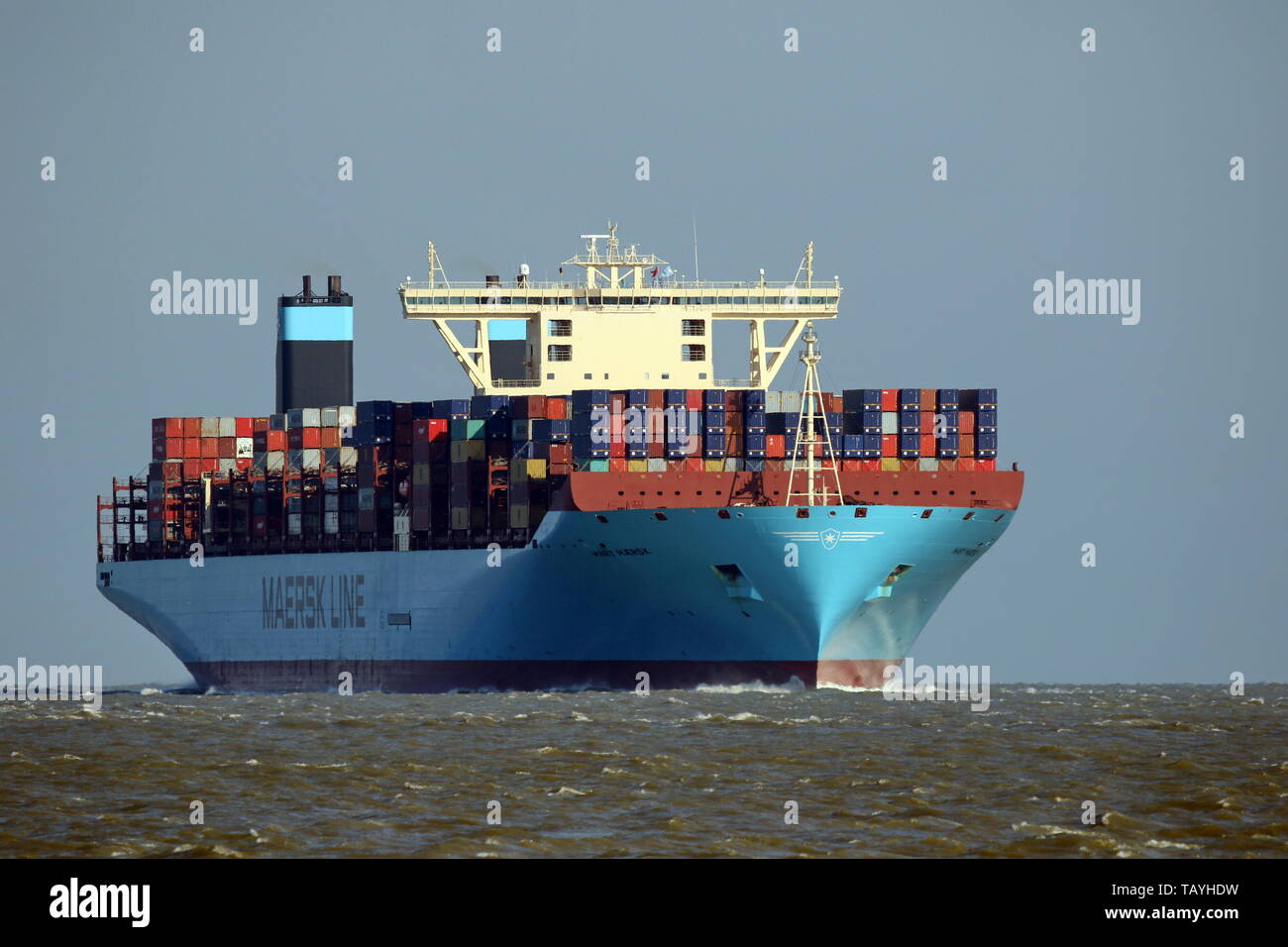 The container ship Mary Maersk passes on 16 April 2019 the port of Cuxhaven and continues to Hamburg. Stock Photo