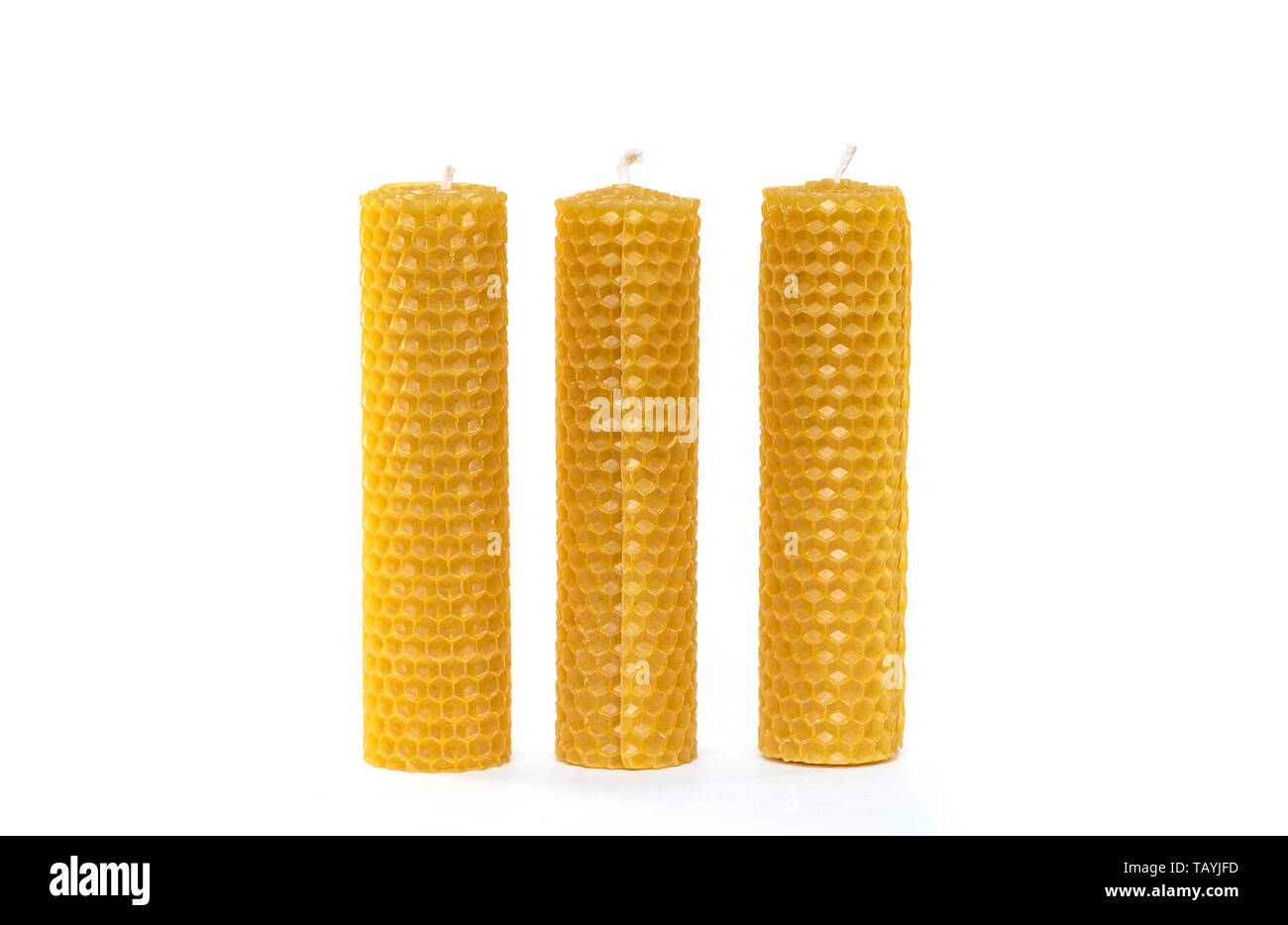 Three wax Candles with wax isolated on white Background