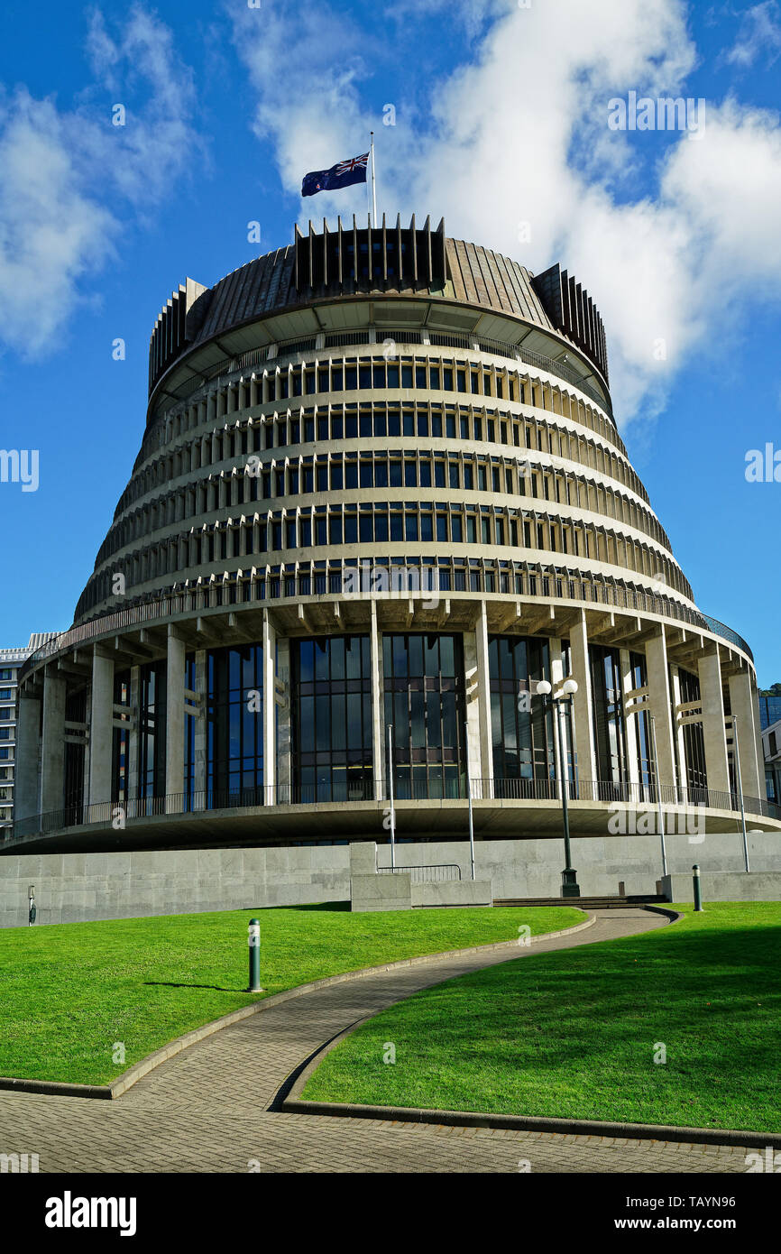 The Beehive - New Zealand parliament building with flag flying on a sunny day in Wellington. Stock Photo