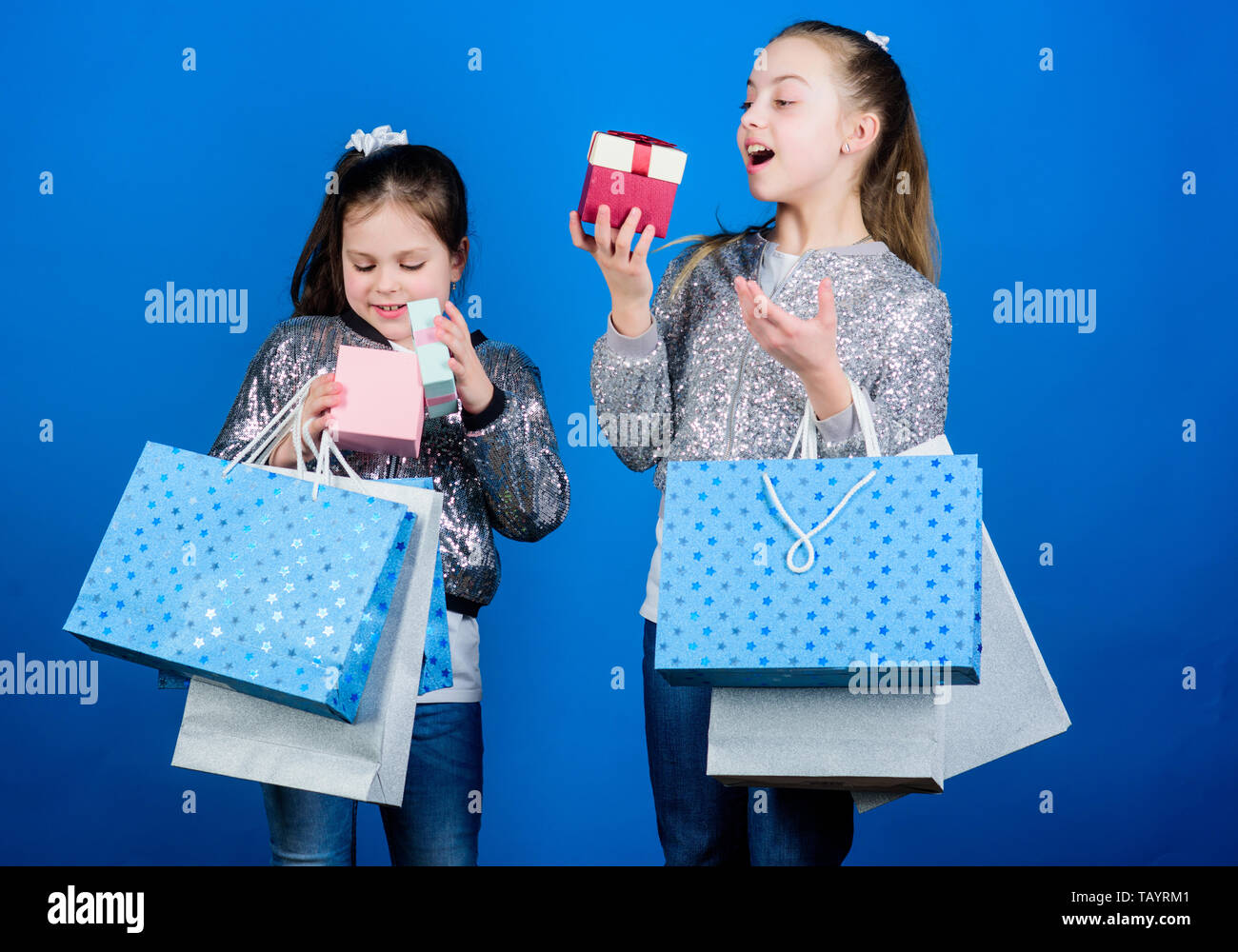 Black Friday Sale And Discount Shopping Day Children Bunch Packages Kids Fashion Girls Sisters Friends With Shopping Bags Blue Background Every Product Delivered To You Shopping And Purchase Stock Photo Alamy