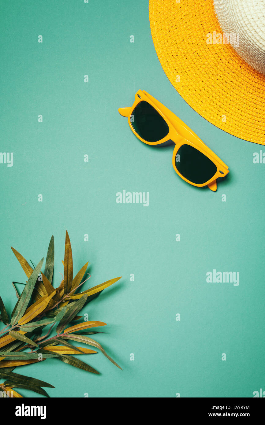 Straw hat and sunglasses in summer holiday concept, top view flat lay ...