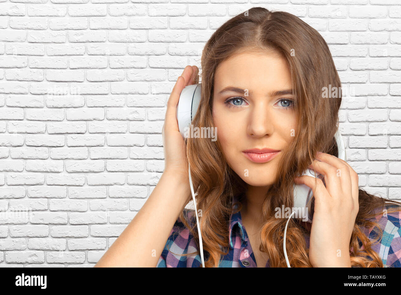 Happy young woman listening to music Stock Photo - Alamy
