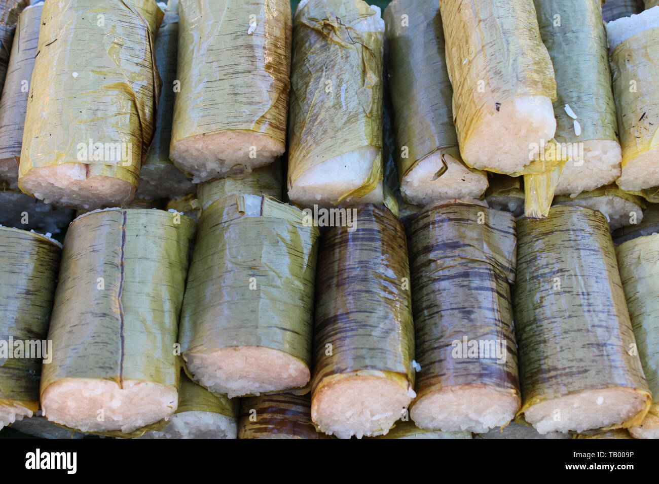 Street food called lemang (rice dumpling) a Malaysian local food and a must delicacy during festive season in Malaysia, Singapore, Indonesia and Brune Stock Photo