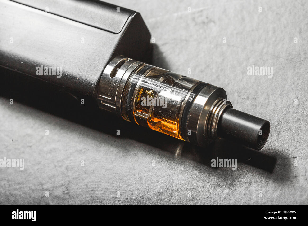 The most popelar modern electronic cigarette over black background. Vape.  Vapor Stock Photo - Alamy