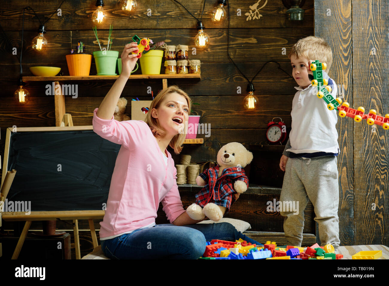 Daycare concept. Little child play daycare game with woman. Daycare ...