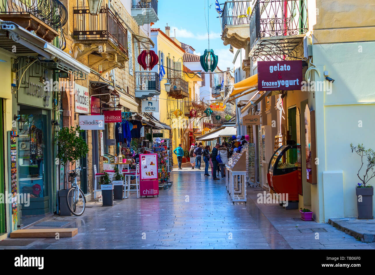 Nafplio, Greece - March 30, 2019: Old town street panorama with restaurants and shops in Nafplion, Peloponnese Stock Photo