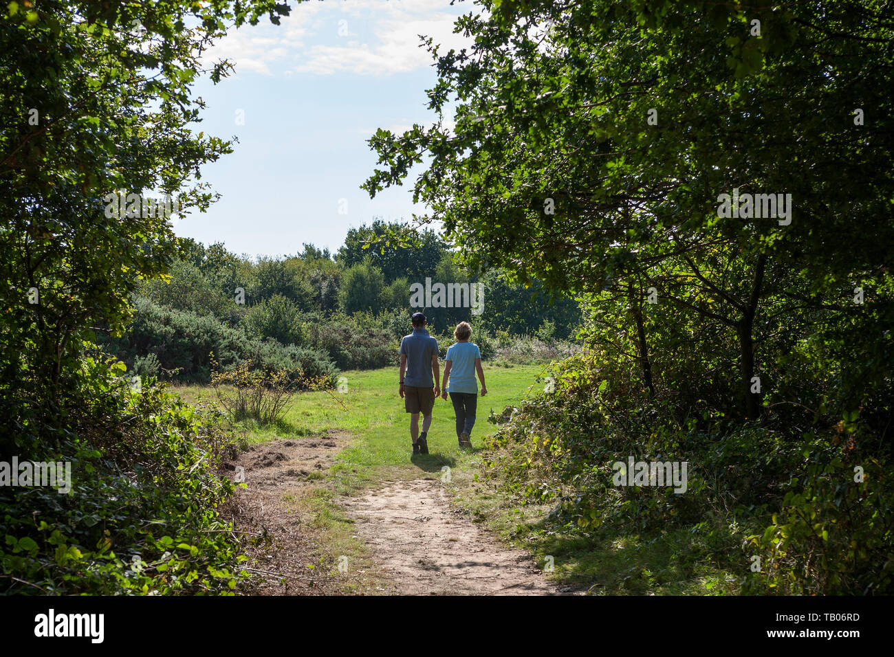 A couple walking in Alver Valley Country Park, Gosport, Hampshire, UK.  MODEL RELEASED Stock Photo