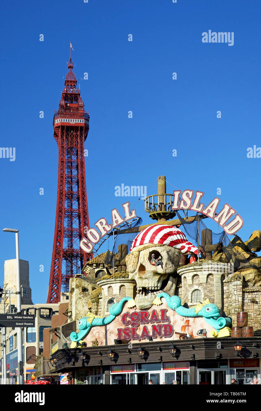 The famous Blackpool  looms over the Coral Island amusement complex in Blackpool, Lancashire, England, UK Stock Photo