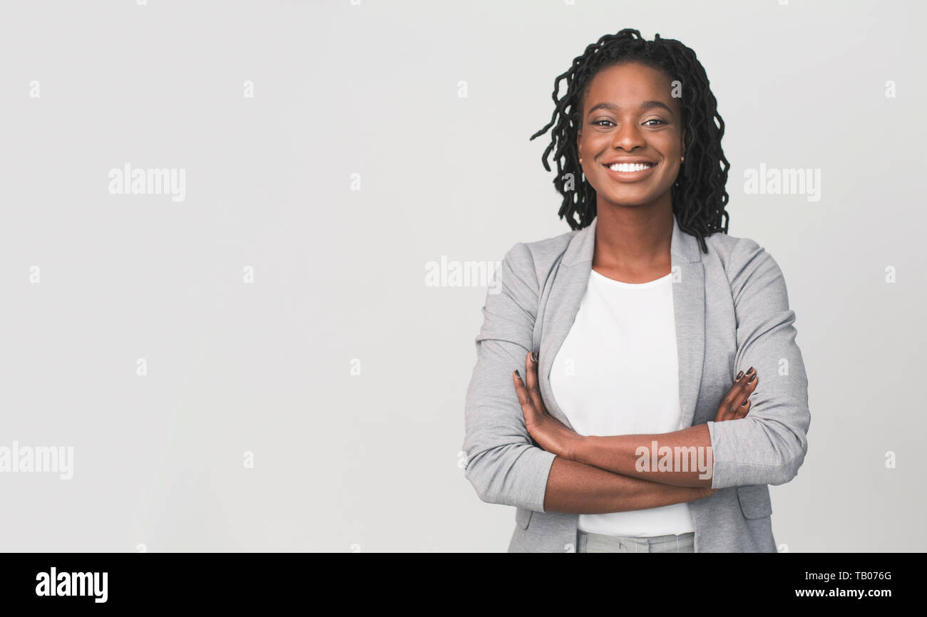 Successful African Businesswoman With Arms Crossed, Grey Background ...