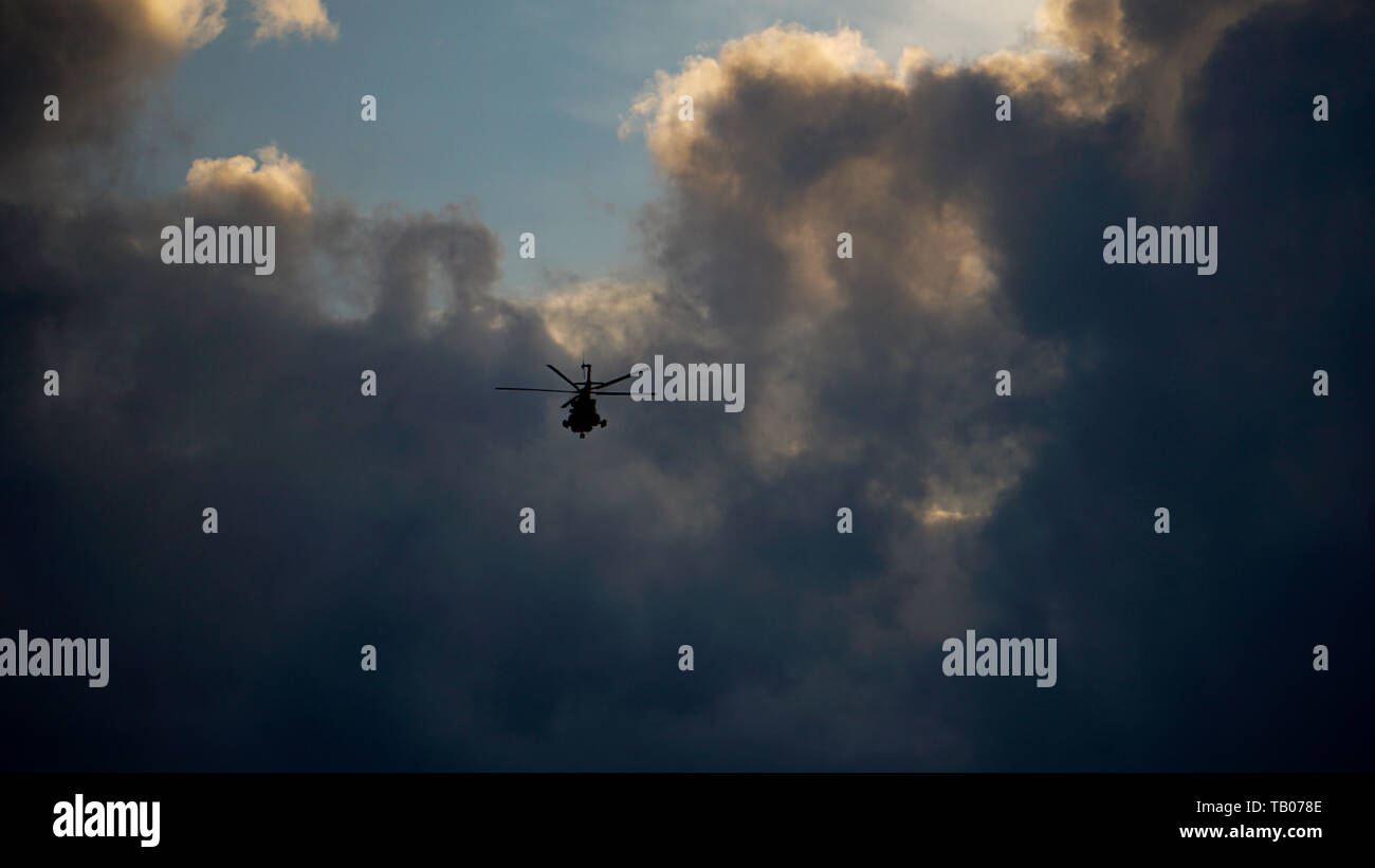 Helicopter in flight cloudy hi-res stock photography and images - Alamy