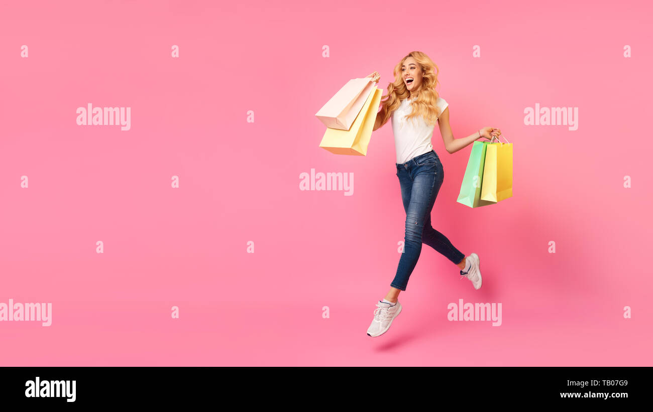 Big Sales. Girl Running With Shopping Bags Stock Photo Alamy