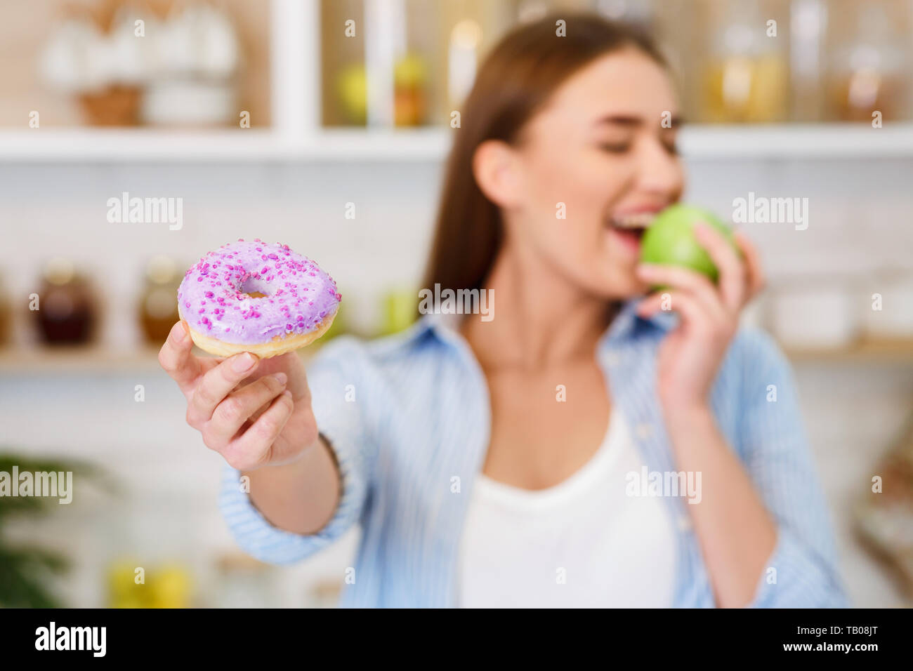 Healthy Eating. Girl Rejecting Junk Food, Choosing Fresh Apple Stock Photo