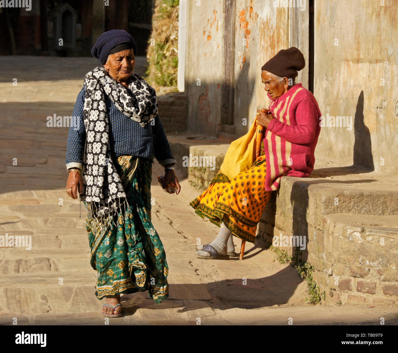 Old woman sitting on the street hi-res stock photography and images - Alamy