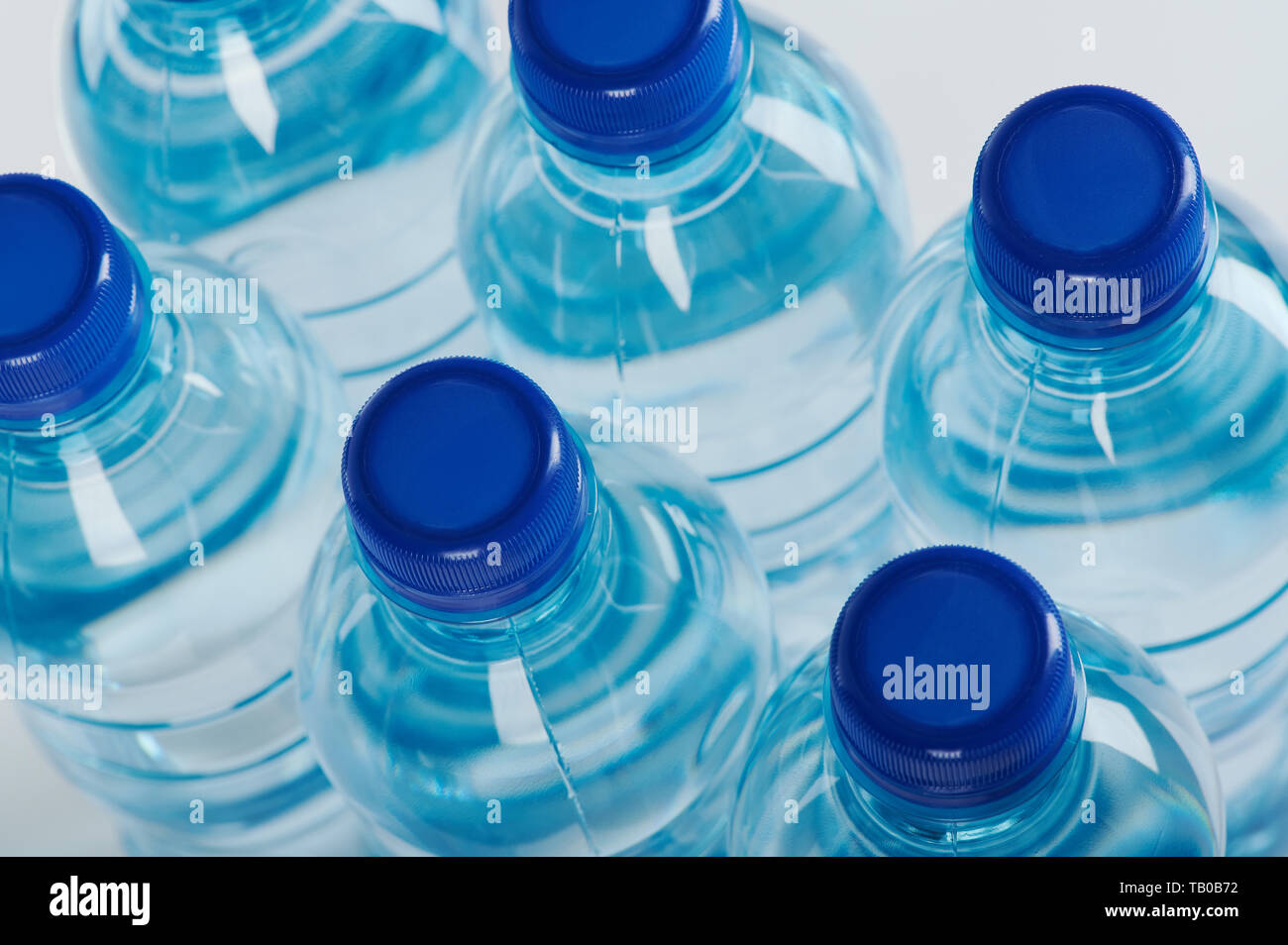 Group of blue plastic bottles above top view close up Stock Photo