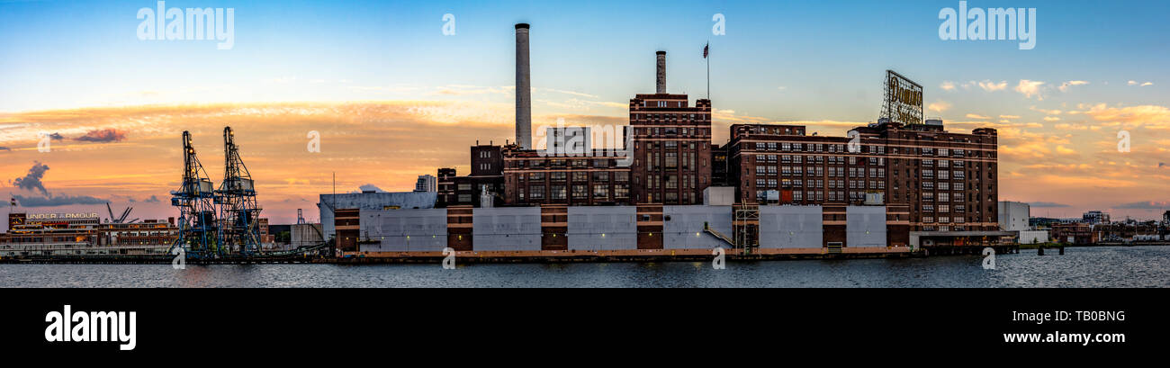 Baltimore, Maryland, USA - July 8, 2017: A panoramic view of the Domino Sugar refinery, the last manufacturing plant on the Inner Harbor. In operation Stock Photo