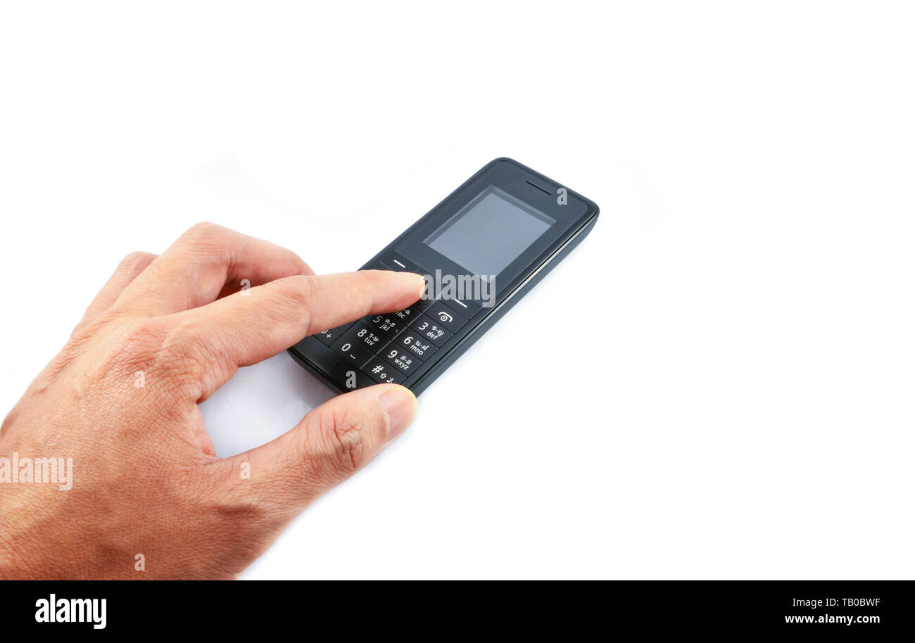 Hand pressing on Telephone / Old model mobile phone isolated on white background Stock Photo