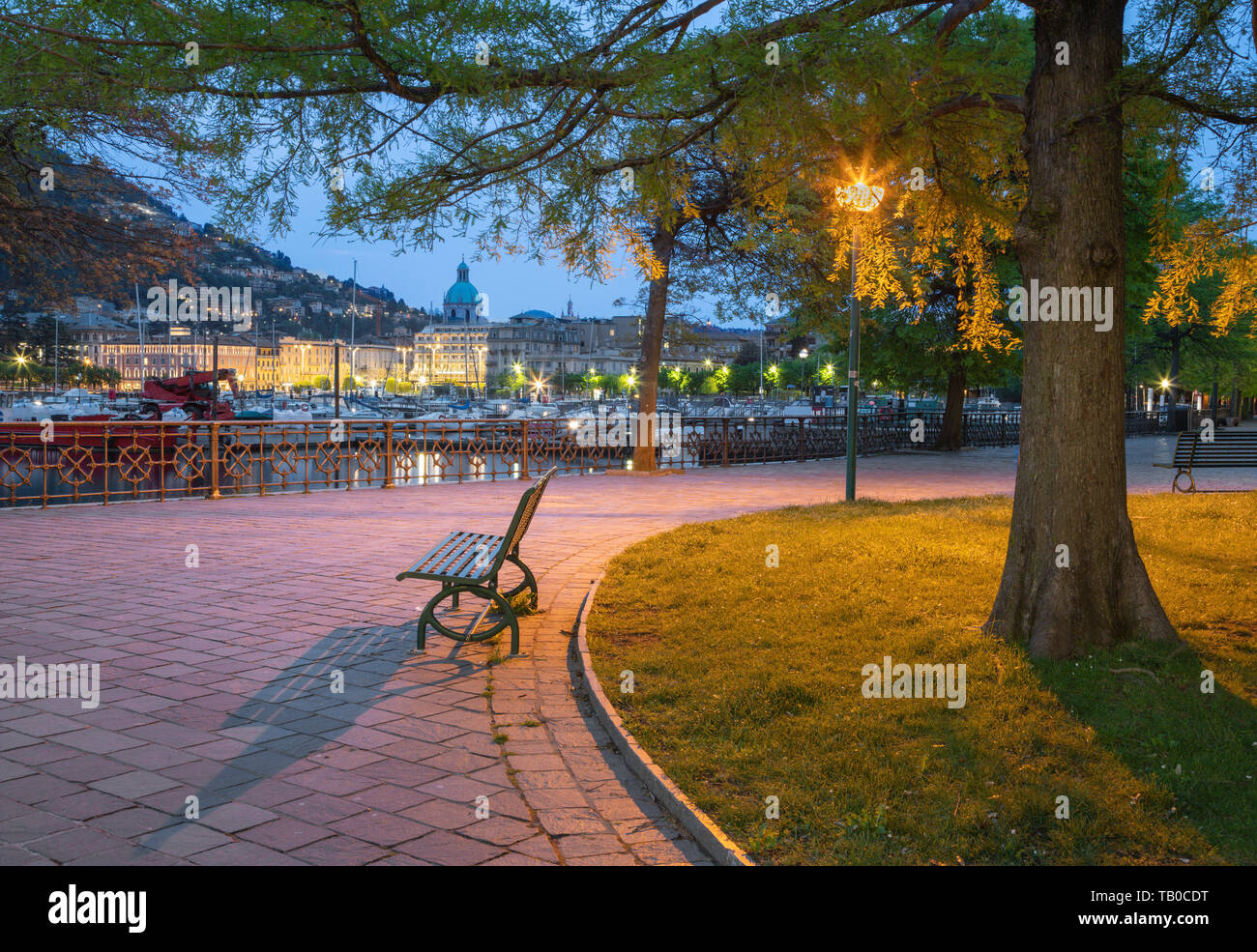 Como - The city with the Cathedral and harbor from the promenade in the morning dusk. Stock Photo