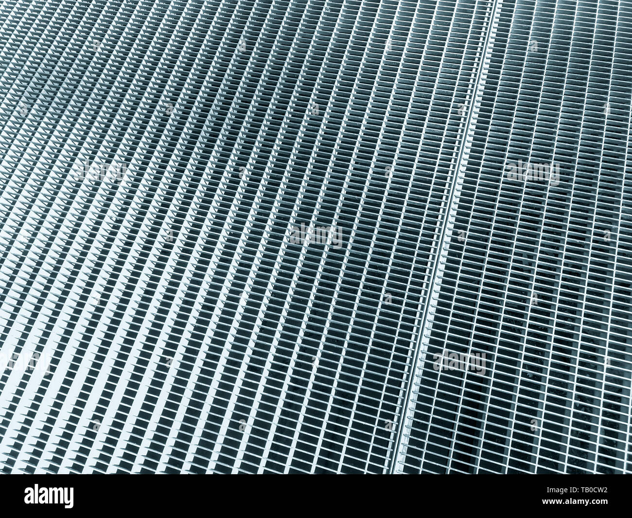 texture background of metal grid. stainless steel mesh. sidewalk subway grate or ventilation grid Stock Photo