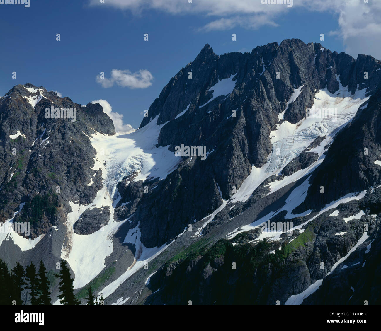 USA, Washington, North Cascades National Park, Pelton Peak (left) and Magic Mountain (center) tower above Pelton Basin. Stock Photo