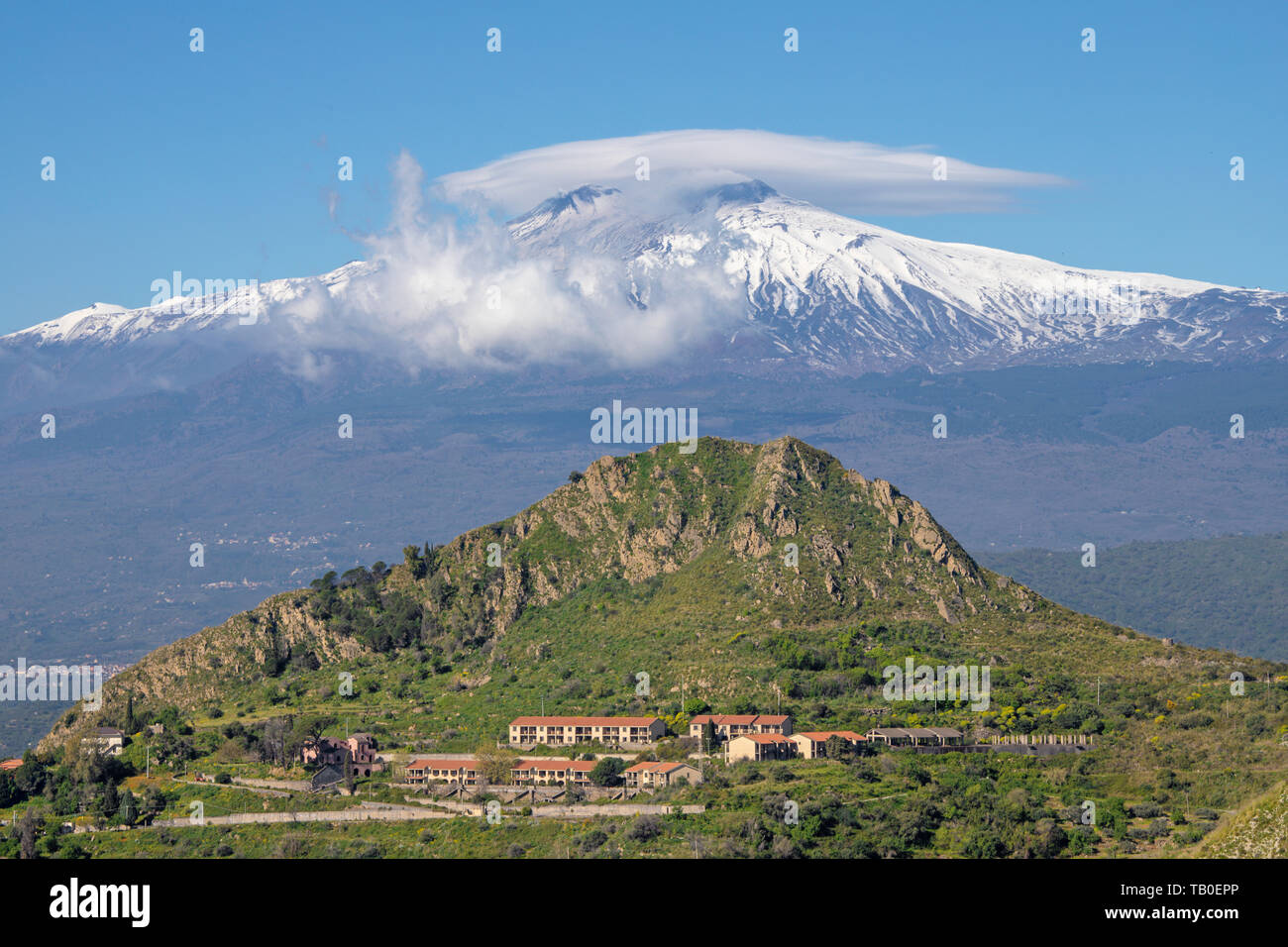 Taormina - The Mt. Etna volcano over the Sicilian landscape. Stock Photo