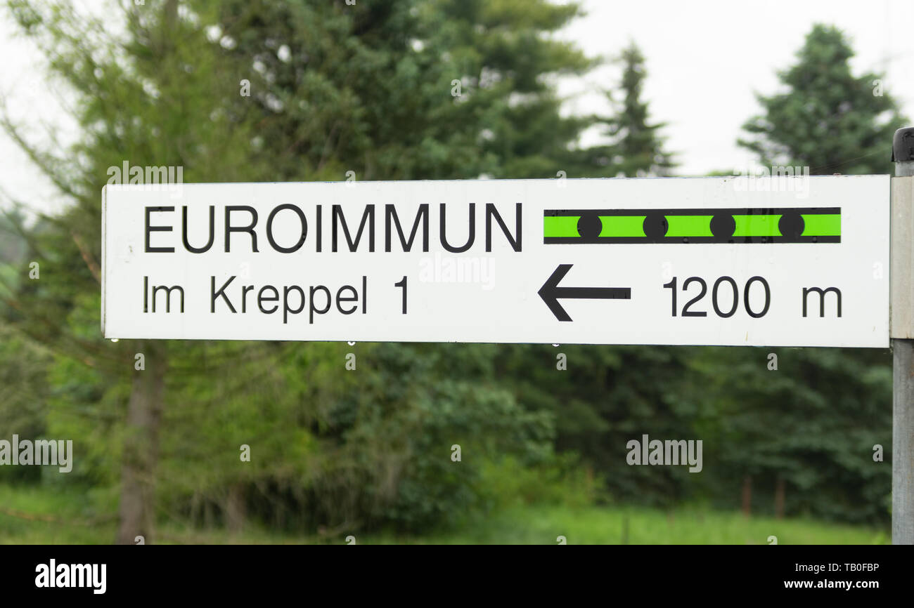 Signpost directing to Euroimmun biotech production plant in Rennersdorf.  A perkinelmer company managed by Winfried Stöcker. Stock Photo