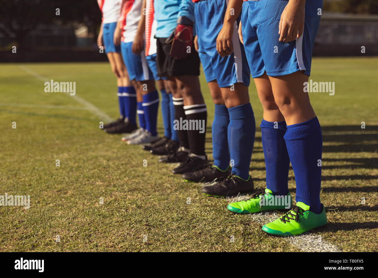 Team of female soccer player standing in row at the sports field Stock ...