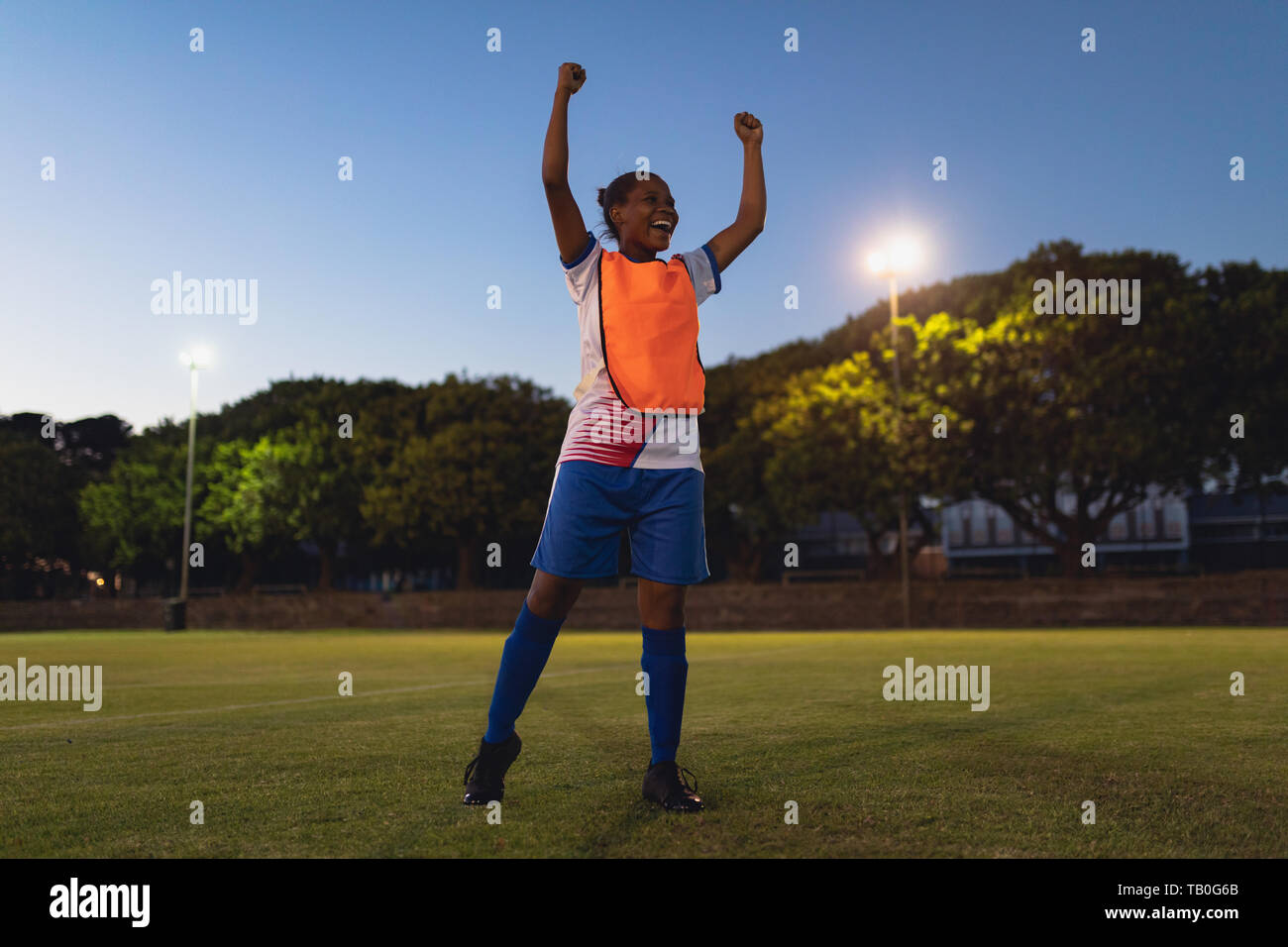Soccer player cheering after victory Stock Photo