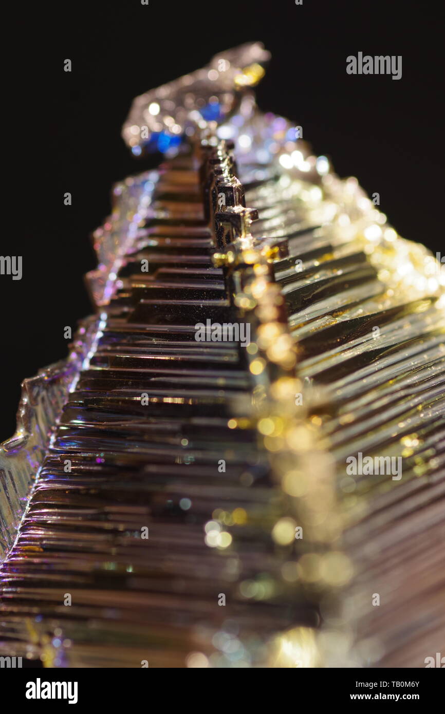 Bismuth Crystal against a Black Background Stock Photo - Alamy