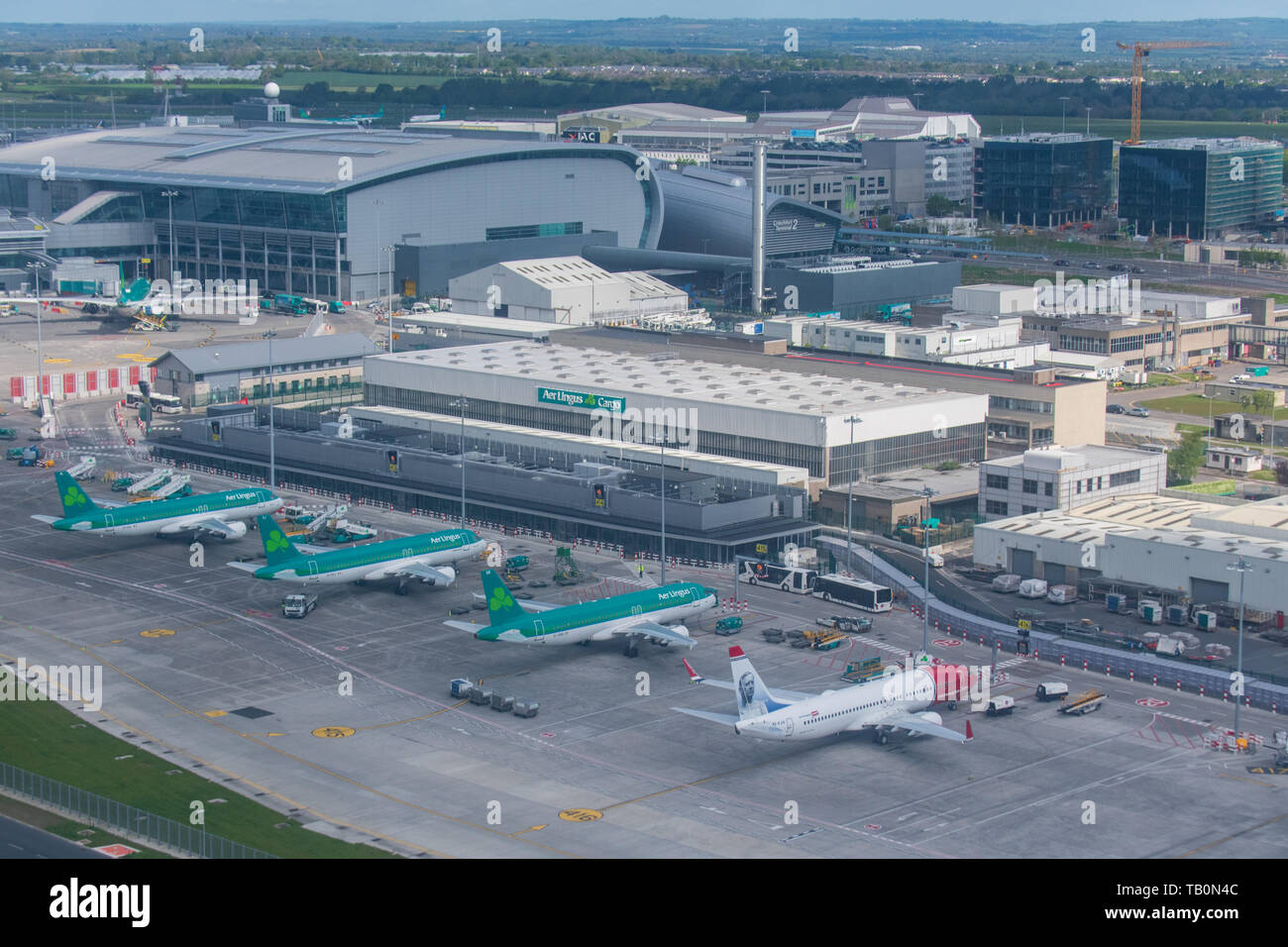 Dublin airport from above - Ireland from above - aer lingus terminal - aer lingus logo - airplane above clouds - Aerfort Bhaile Átha Cliath Stock Photo