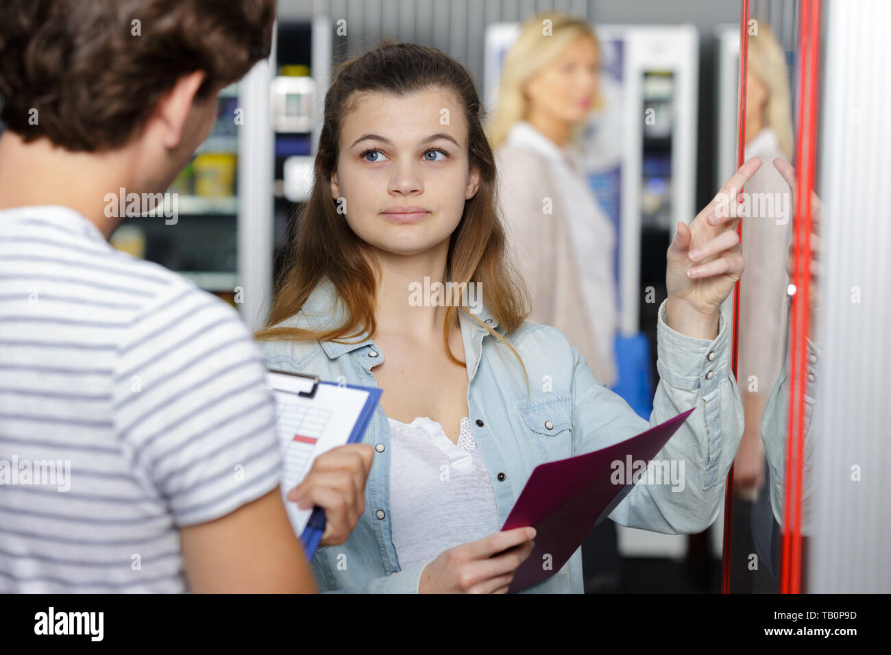 marketing students holding clipboard Stock Photo Alamy