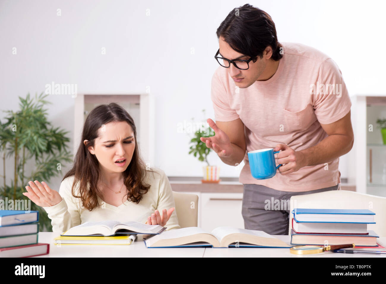 Students preparing for exam together at home Stock Photo - Alamy