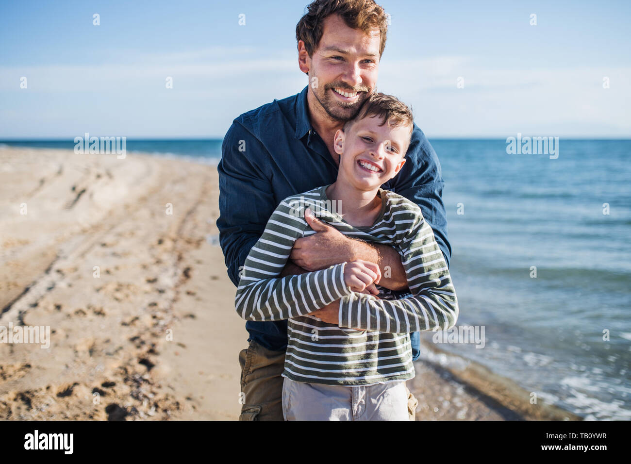 Father hugging son hi-res stock photography and images - Alamy