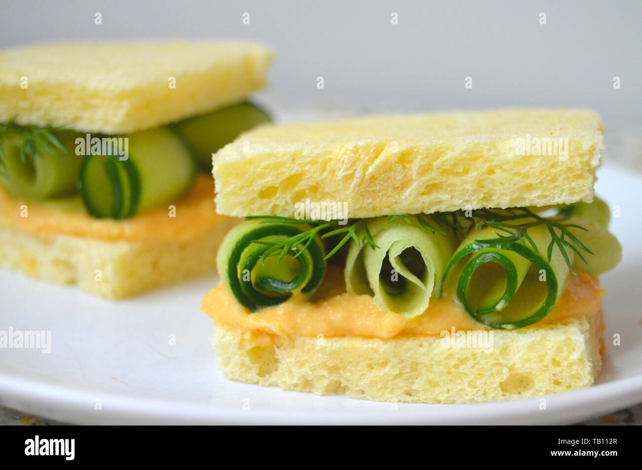 Hummus and cucumber finger sandwiches close caption, cucumber rolls