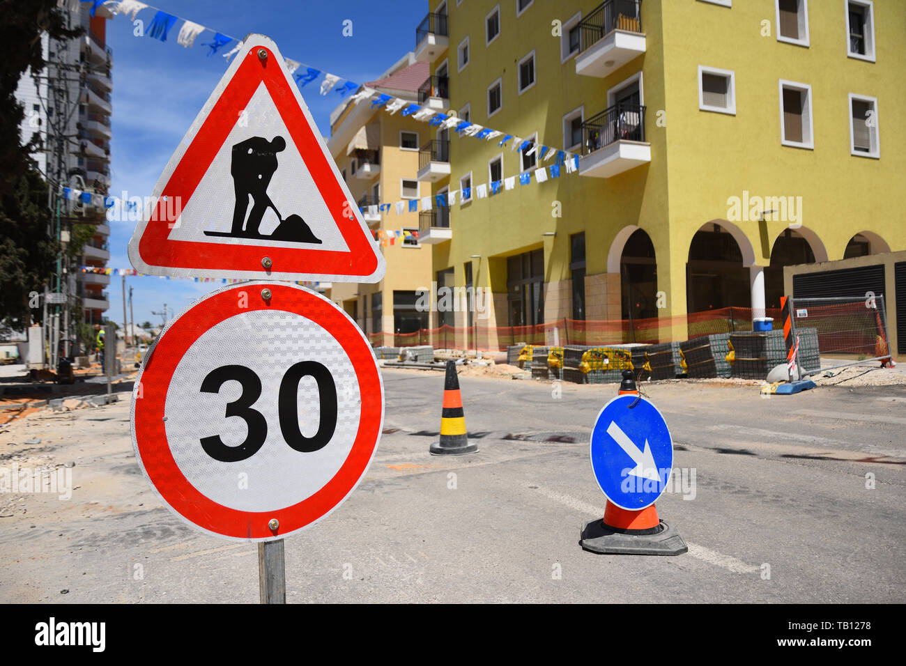 Roadwork and speed limit traffic signs in Yehud - small city in central Israel. Stock Photo
