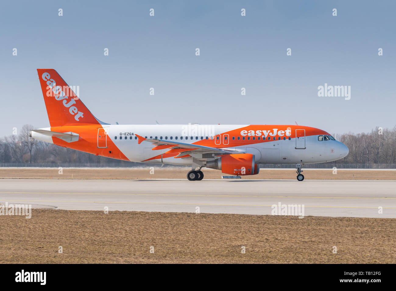 Munich, Germany - February 28. 2019 : easyJet Airbus A319-111 with the aircraft registration number G-EZGA is taxiing for take off on the northern run Stock Photo