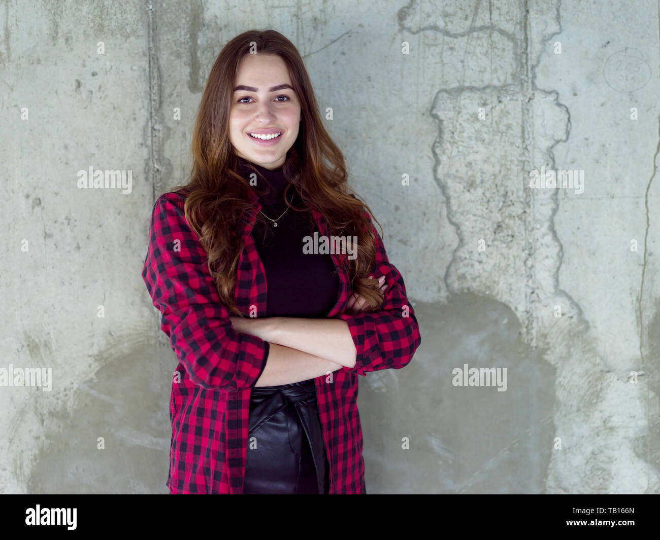 portrait of young female architect on construction site while checking documents and business workflow in new startup office Stock Photo