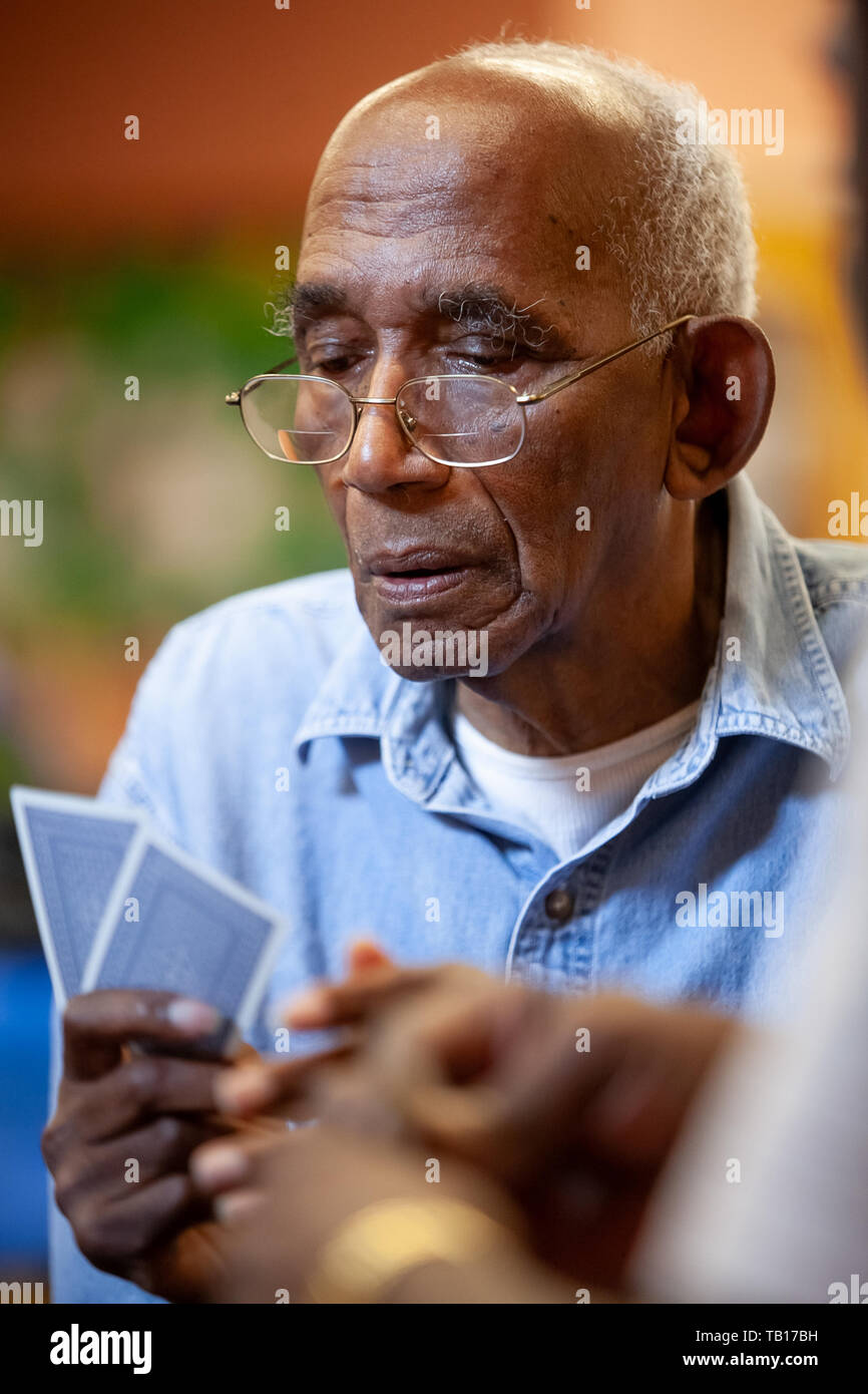 African American seniors playing cards at a senior center in Ardmore PA Stock Photo