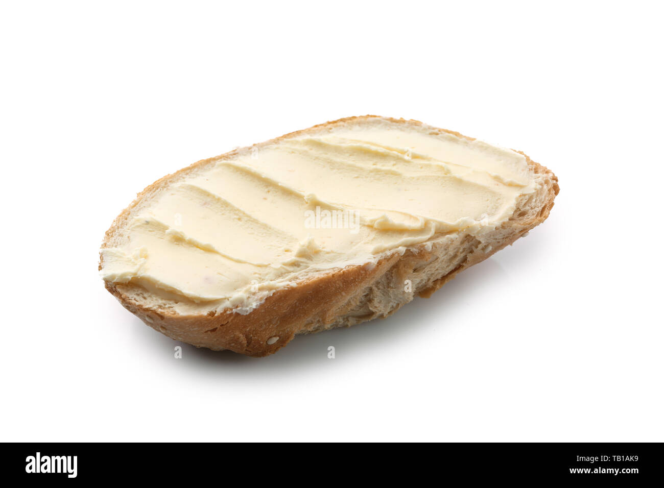 Slice of bread with butter on white background Stock Photo - Alamy