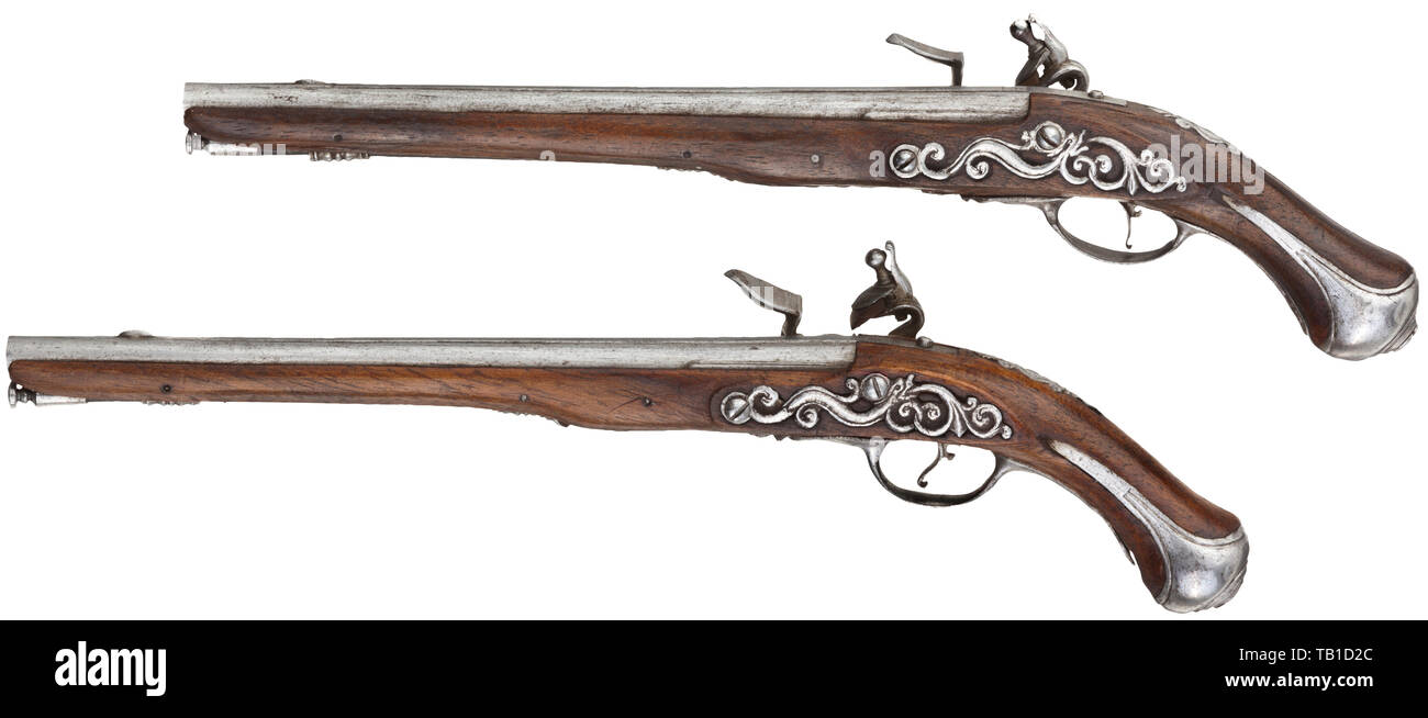 https://c8.alamy.com/comp/TB1D2C/a-pair-of-french-miniature-pistols-18th-century-smooth-barrels-in-35-mm-calibre-with-perforated-vent-holes-and-distinct-barrel-rib-functional-slightly-engraved-flintlocks-walnut-full-stocks-with-fine-openwork-side-plates-and-cut-iron-furniture-ramrods-made-of-whalebone-length-14-cm-detailed-miniatures-of-the-highest-gunsmith-quality-miniatures-miniature-small-mini-historic-historical-additional-rights-clearance-info-not-available-TB1D2C.jpg