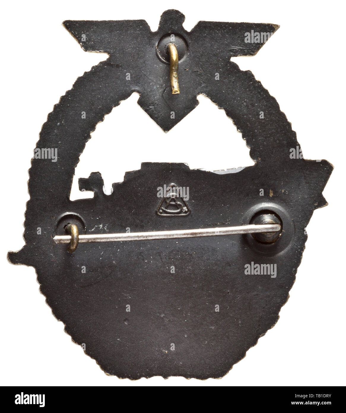 An E-Boat War Badge 2nd model, Manufactured in zinc by the firm Adolf Scholze in Grünwald a.d. Neiße, with horizontally affixed attachment pin system and maker's logo 'AS' within a triangle. Lightly used badge with almost completely preserved gilding, the reverse blackened. Width 52.7 mm. Weight 31.7 g. The zinc badges produced by the Scholze firm of the 2nd model in use from January 1943 with the larger depiction of the new S-38 boat type are, for the period, of outstanding workmanship. These models are among the rare examples that have retained their gilding as well as th, Editorial-Use-Only Stock Photo