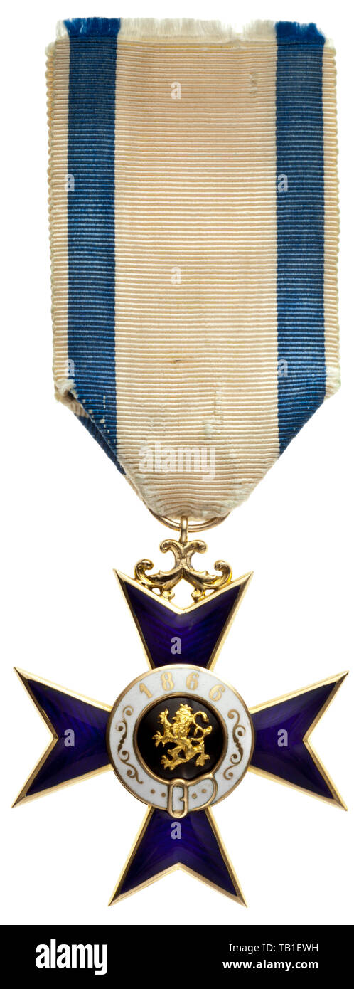 Military Merit Order - a Knight's Cross 2nd class to 1905 by Hausinger, Cross of the order produced by orders jeweller Adam Hausinger in Munich, probably for the 1870/71 war with light enamel scratches, on its original ribbon, punched 'AH' in the suspension ring. Width 41 mm. Weight 11 g. Until 1891 (swords instituted) the 'war decorations' could not be distinguished from the few peacetime awards. The second knight's class was supplied exclusively by Hausinger, Quellhorst and Merck. medal, decoration, medals, decorations, badge of honour, badge o, Additional-Rights-Clearance-Info-Not-Available Stock Photo