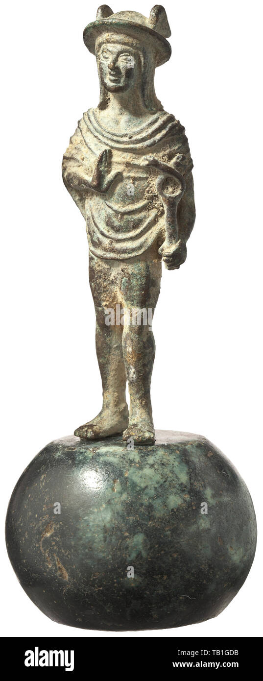 A bronze statuette of Mercury, Italian Renaissance, 15th century, Image of the deity with his bent right arm held in front of his body, the hand raised similarly to the Christian gesture of blessing. The wand of Mercury in his left hand. Tunic-style garment, 'page-boy' hairdo, Mercury's hat with wings. The hairstyle, the shape of the hat, the folds of the garment as well as other technical and stylistic details are clearly indicative of a Renaissance figure. Charming, very finely crafted miniature sculpture. Dark green patina with incrustations. , Additional-Rights-Clearance-Info-Not-Available Stock Photo