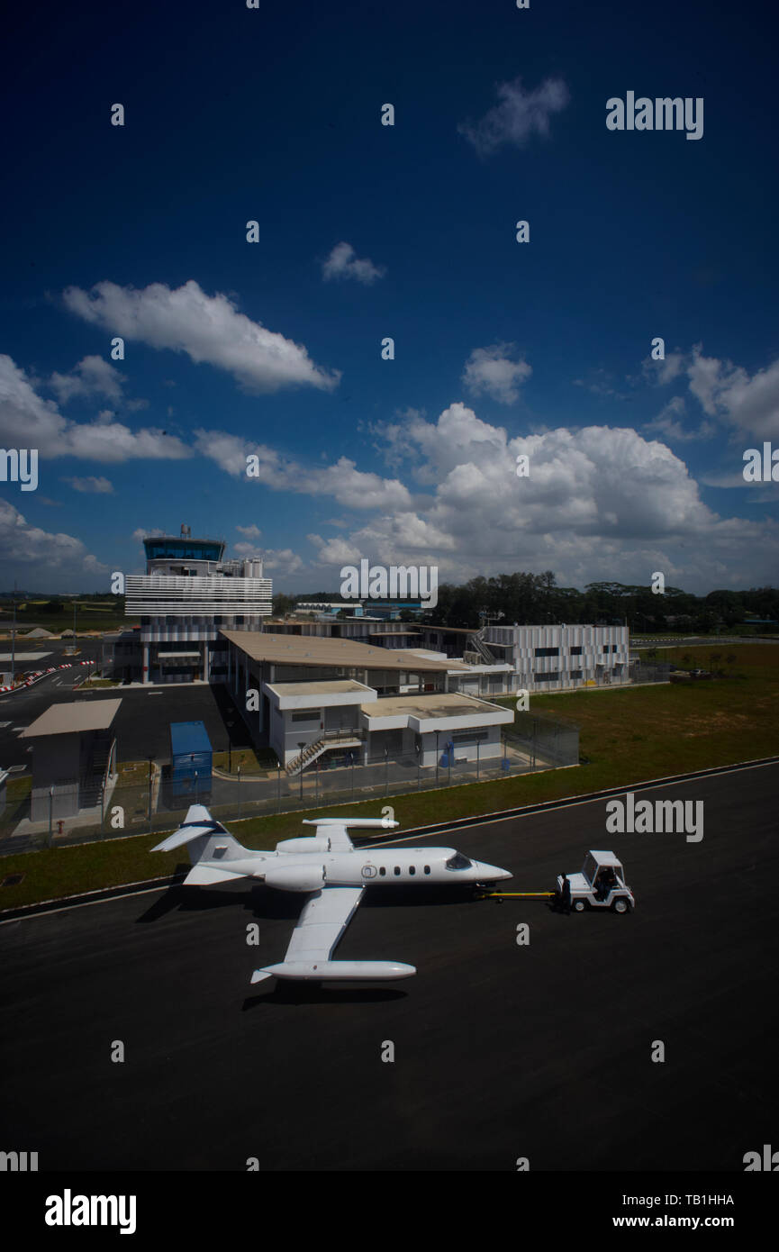 Vertical shot of a private jet on a runway about to take off Stock