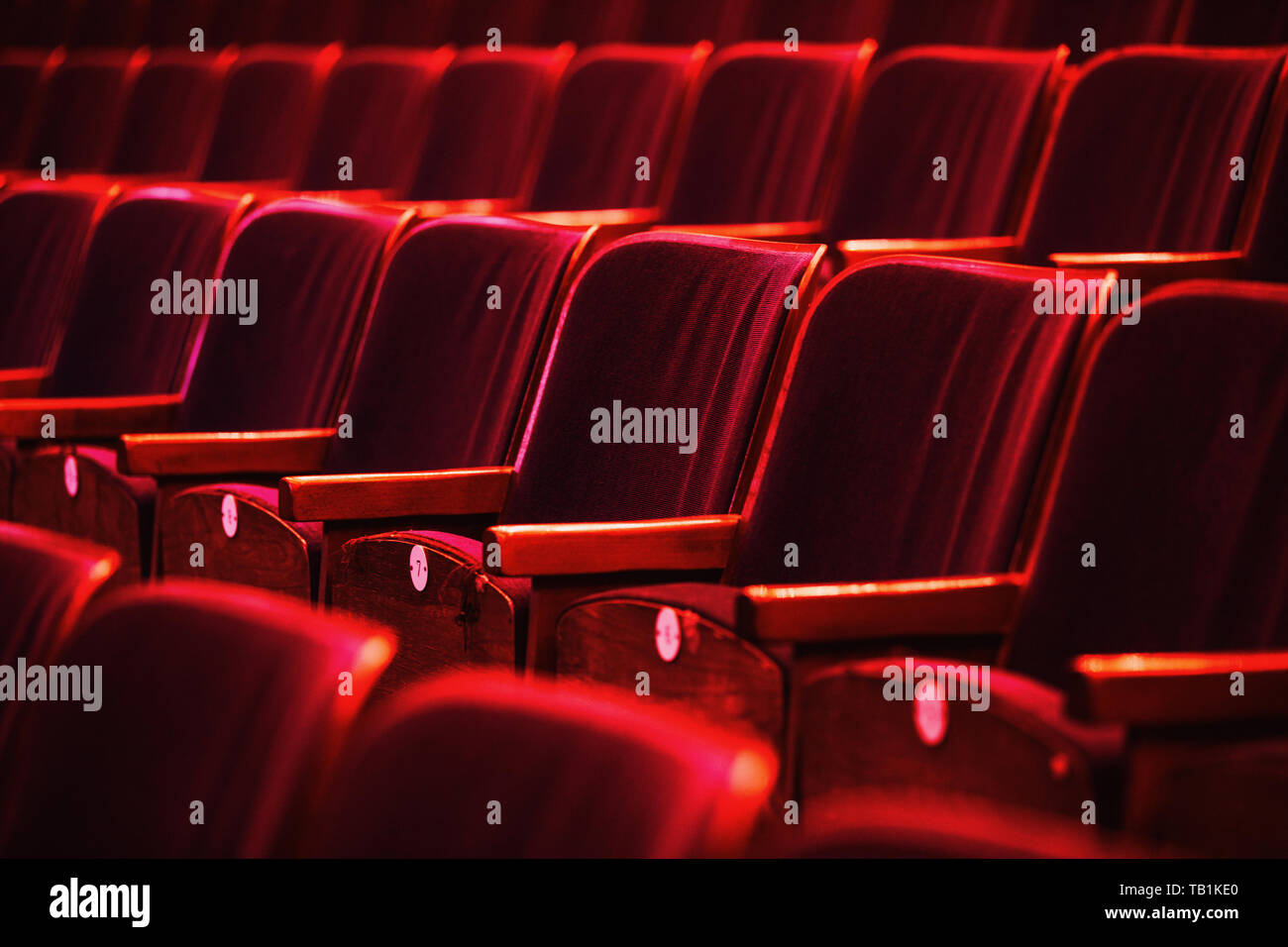 auditorium with seats, chairs in auditorium colored by spotlights Stock Photo Alamy