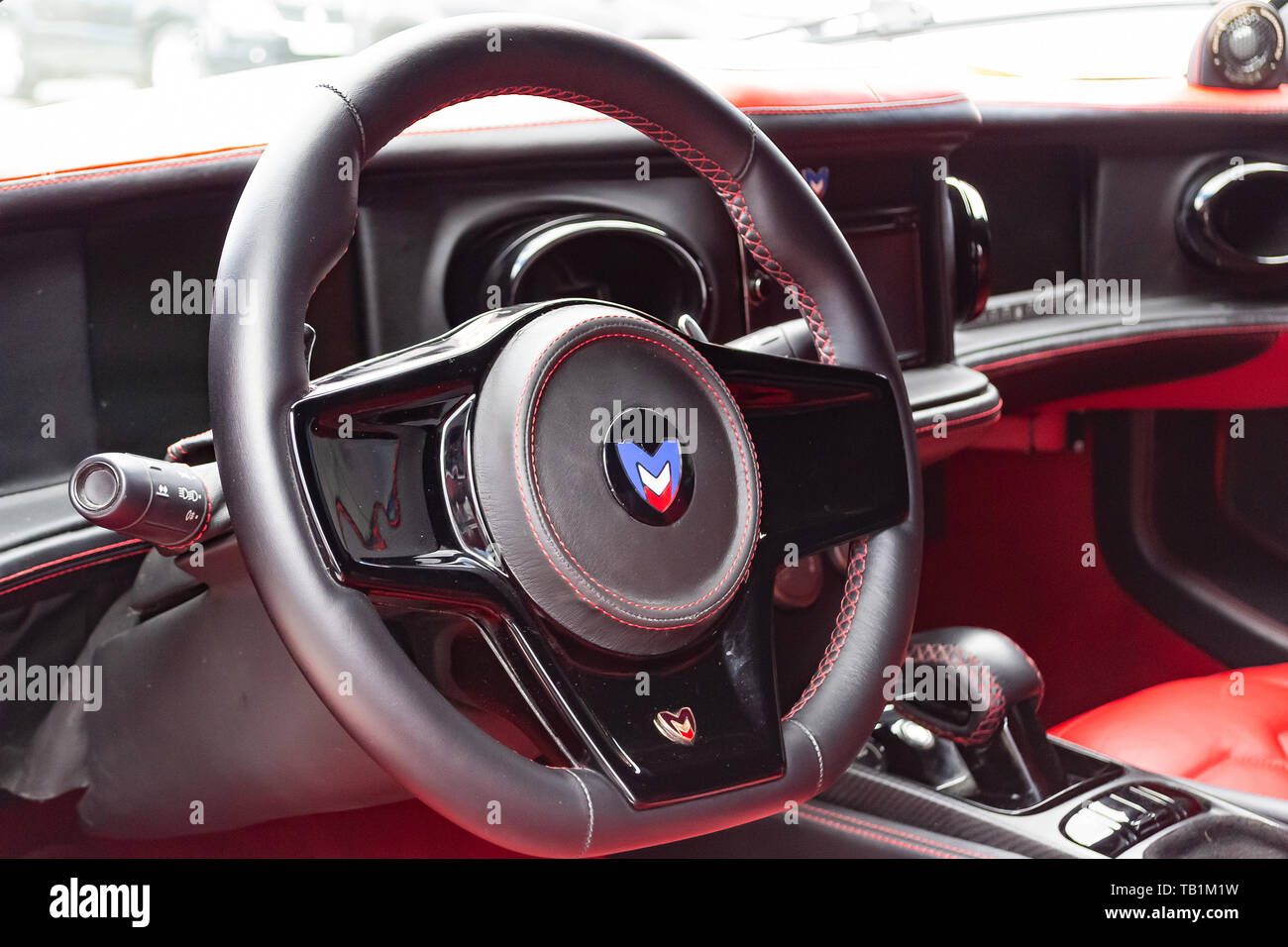 Novosibirsk, Russia - 05.29.2019: Interior of a sports car Marussia B1 of  red color with elegant leather seats, low seating position and steering  whee Stock Photo - Alamy